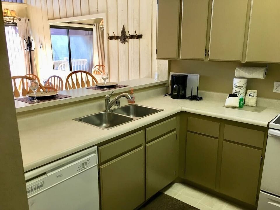 Spacious kitchen with dishwasher, microwave, stove and refrigerator 
