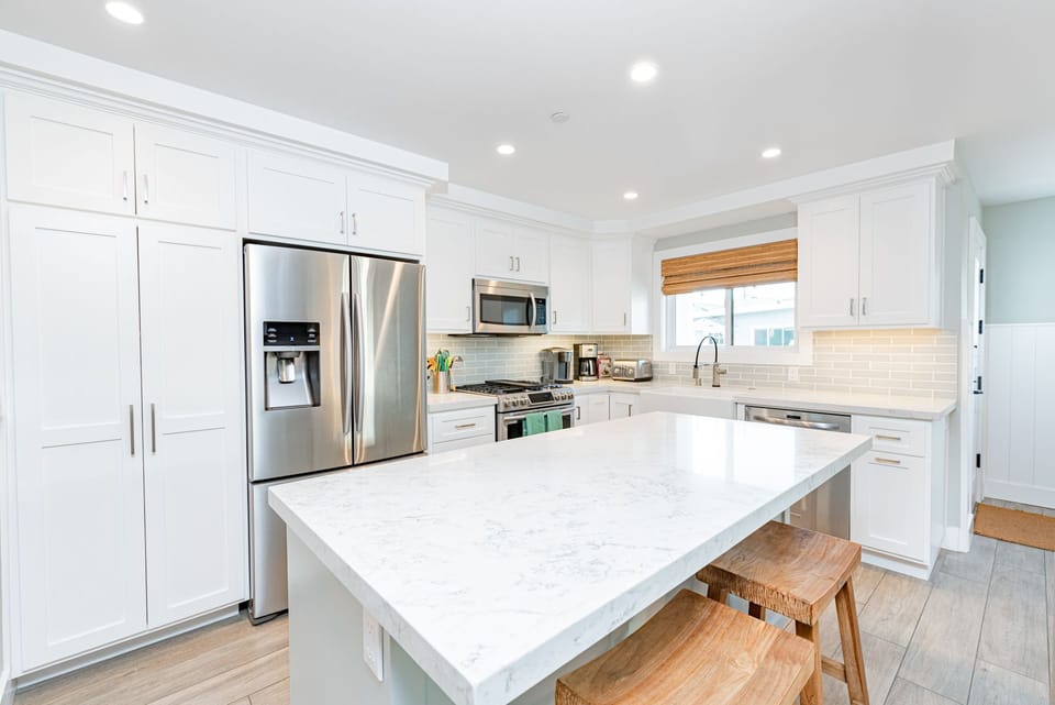 The spacious kitchen island with bar seating makes meal prep a social affair!
                