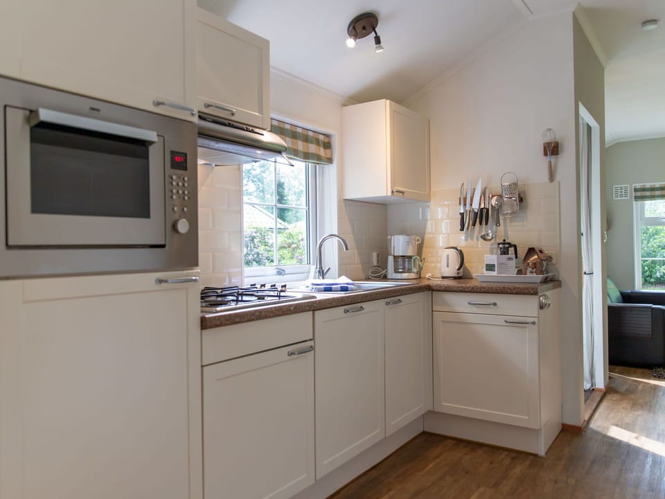 Cabinetry, Countertop, Furniture, Wood, Kitchen Appliance, Interior Design, Lighting, Kitchen, Home Appliance, Ceiling Fan
