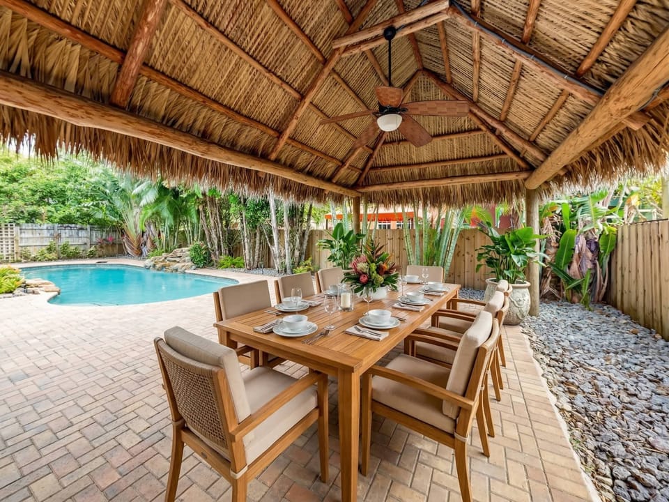 Gather under the shaded tiki hut, where every meal feels like home—relaxed, private, and surrounded by tropical beauty.