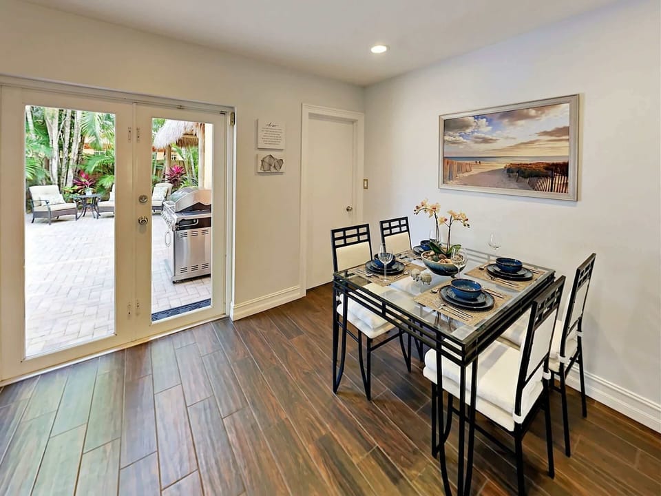 A cozy dining space that opens beautifully to fresh air and outdoor living.
