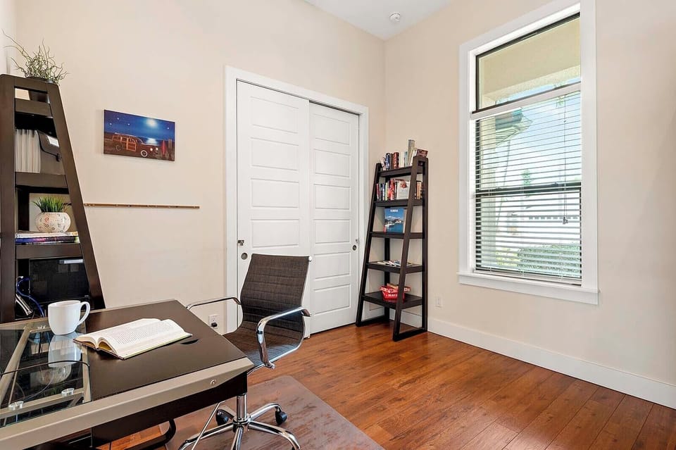 Den Located Next to the Entrance with Designated Working Desk and Garden View
