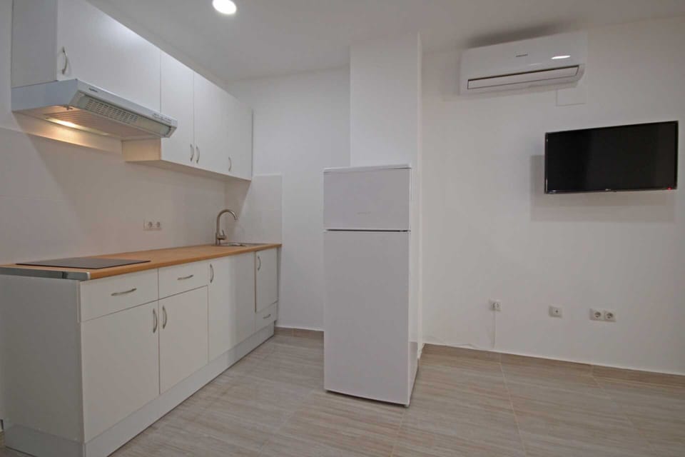 Mini-fridge, stovetop, cookware/dishes/utensils