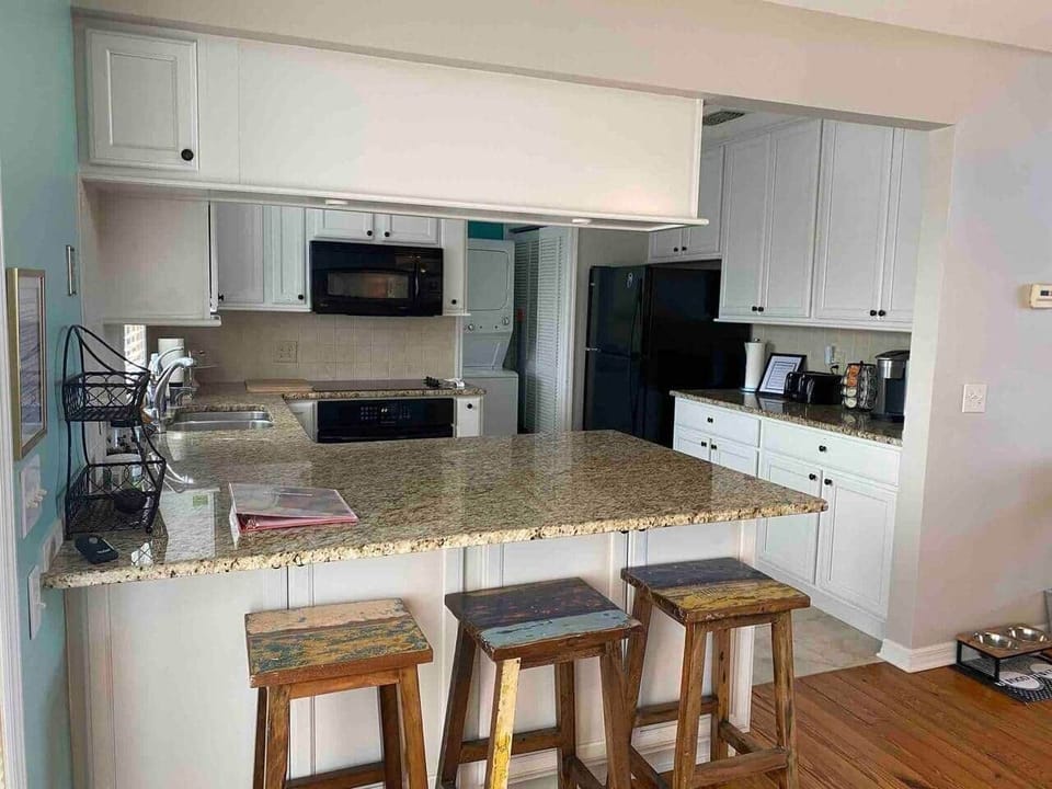 Kitchen with keurig and on demand near boiling water to the right of the sinkand filtered drinking water on the left.