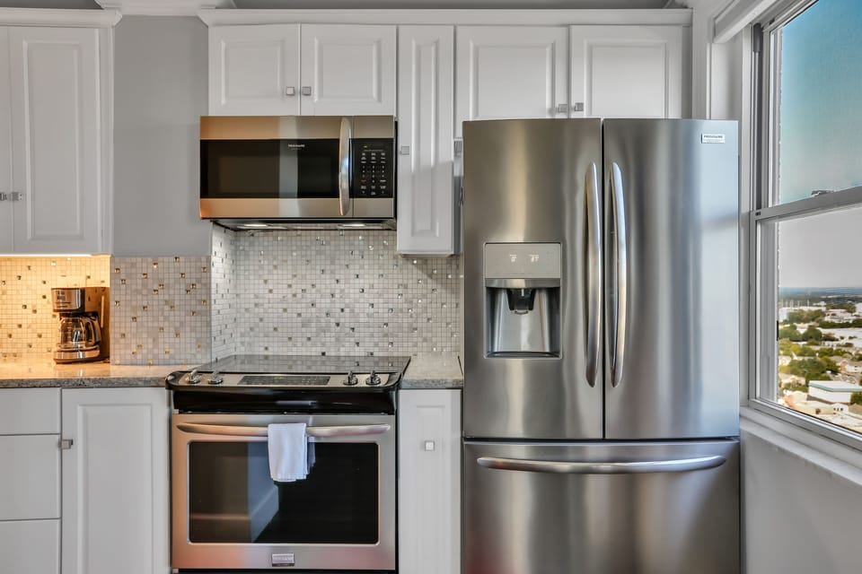 Glistening kitchen with upper end appliances