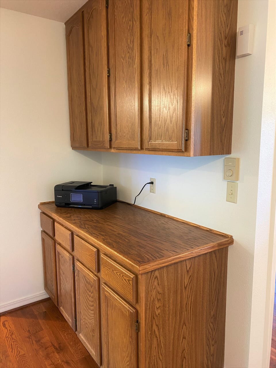 Area with printer and paper. Books, games, videos, etc. 