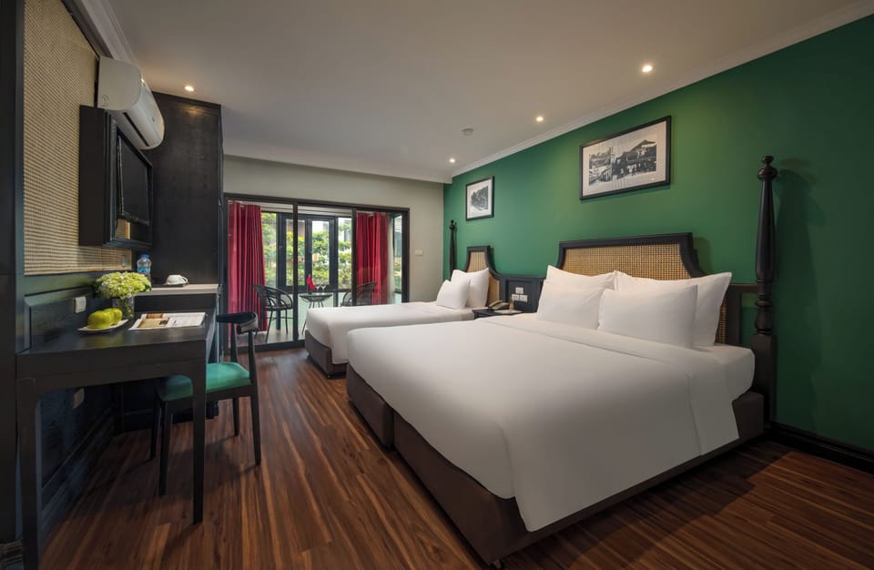 Family Room, Balcony, City View | Minibar, desk, free WiFi, bed sheets
