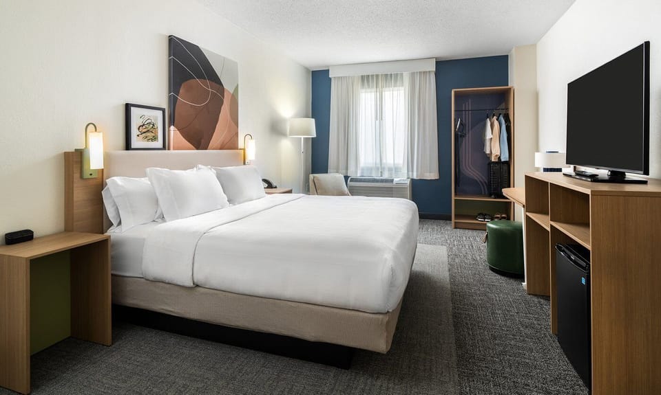 Premium bedding, down comforters, desk, laptop workspace