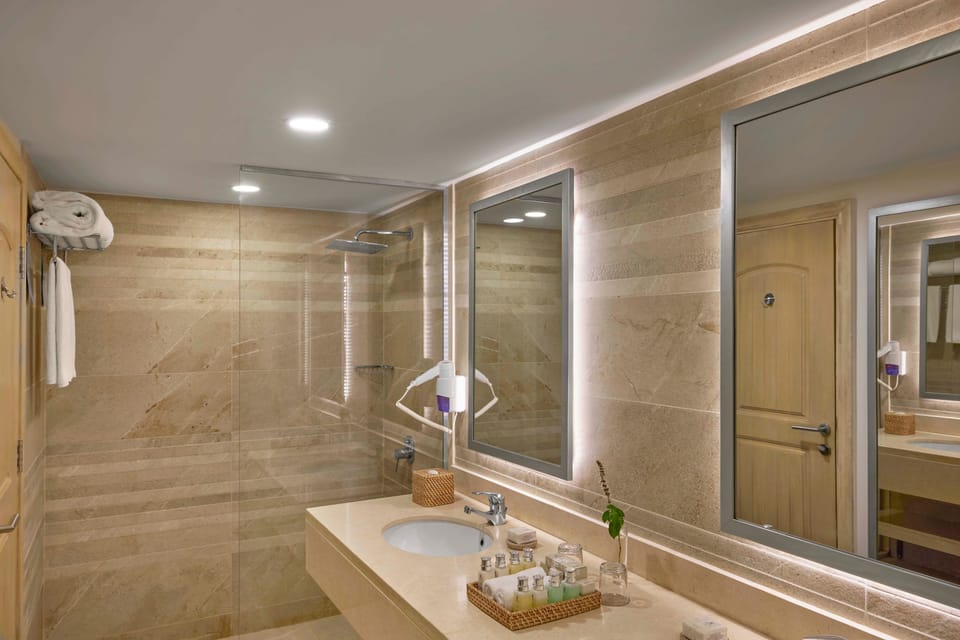 Shower, eco-friendly toiletries, slippers, towels