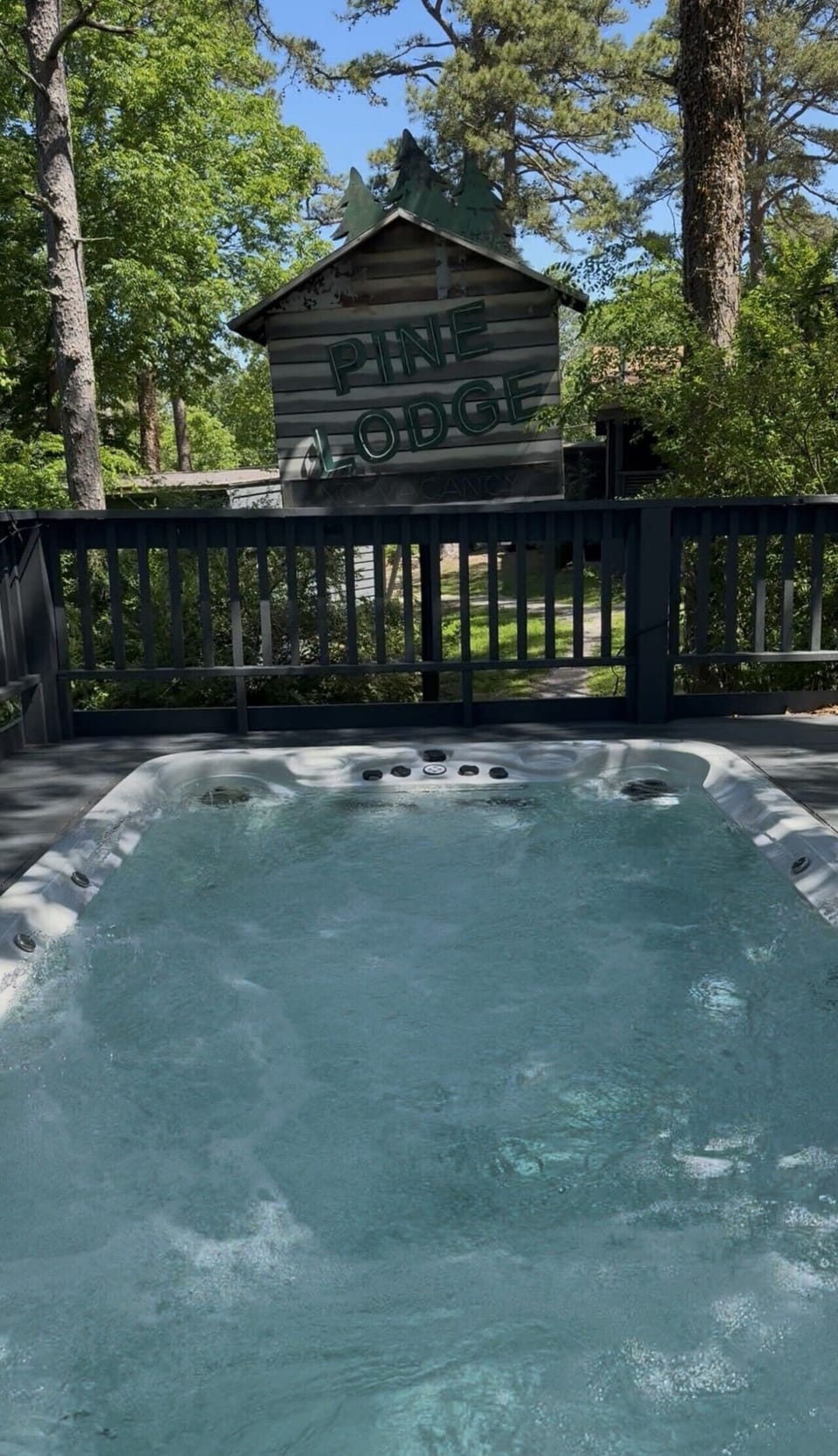 Guests have access to 20` swimspa under vintage sign