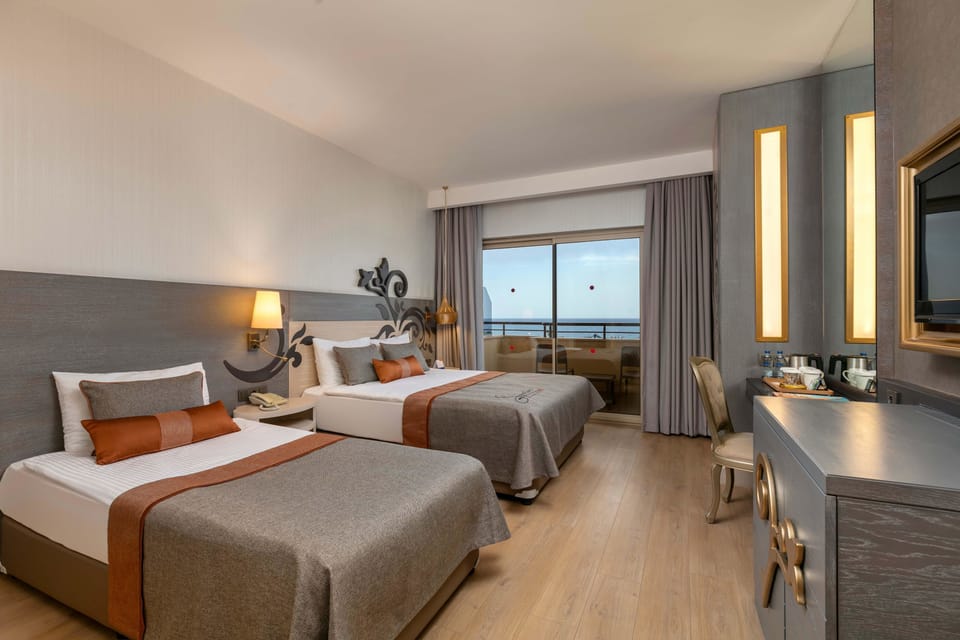 Standard Double Room, Sea View | Free minibar, in-room safe, desk, soundproofing