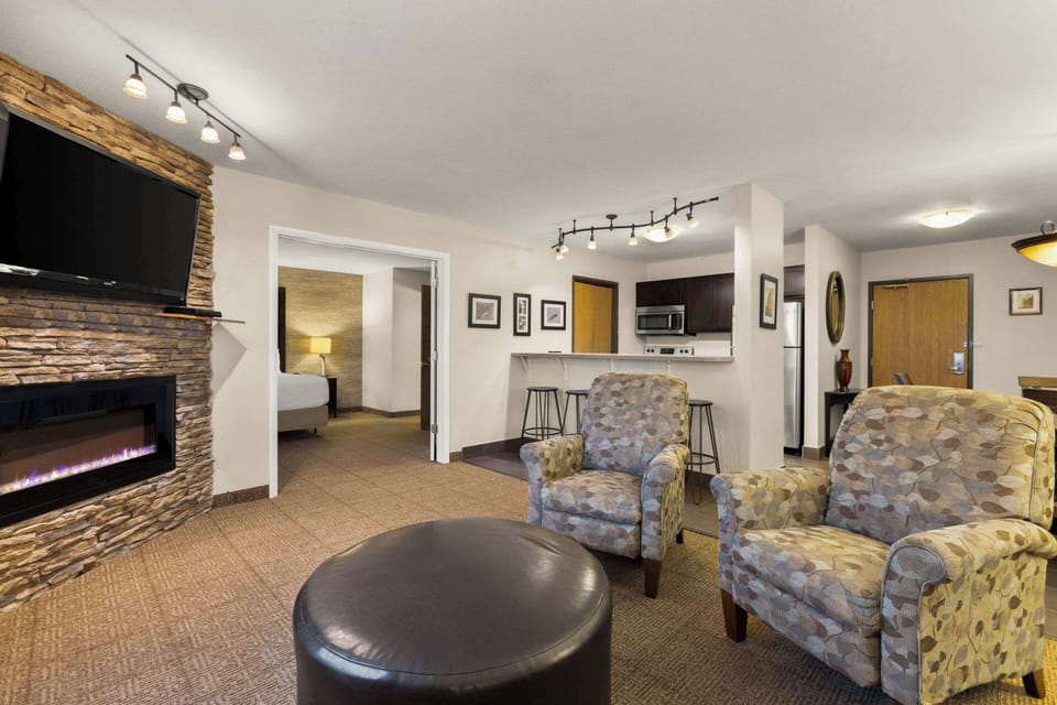 Premium bedding, desk, laptop workspace, iron/ironing board