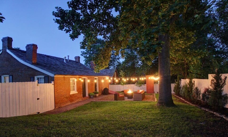 private backyard with firepit and patio furniture 