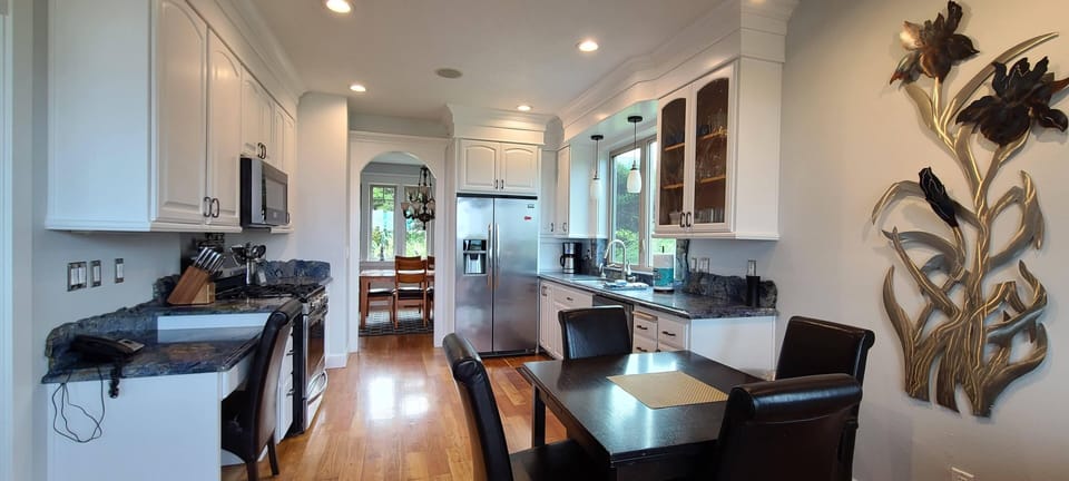 Kitchen and nook with access to lower deck