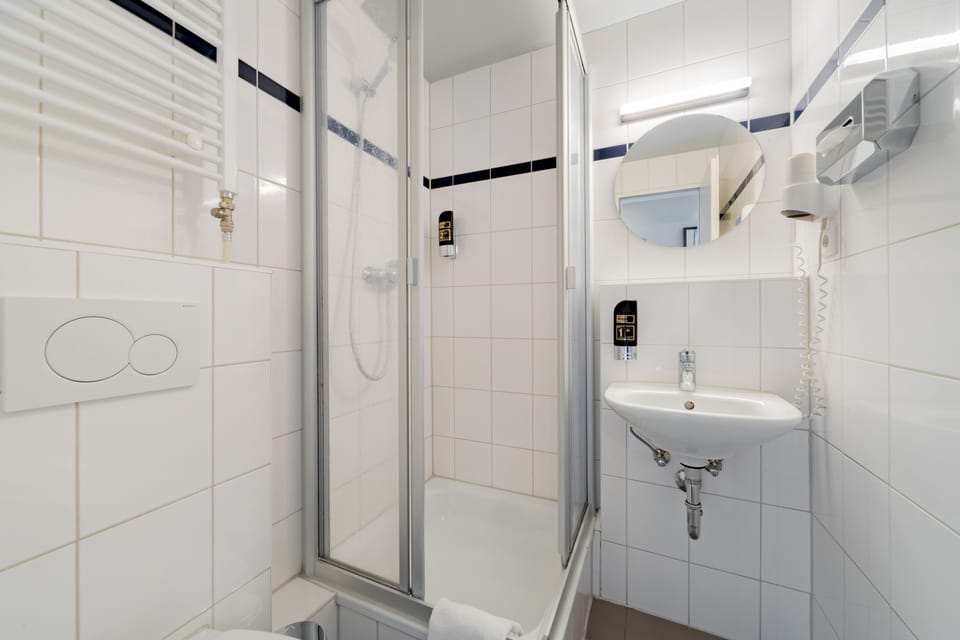 Shower, eco-friendly toiletries, hair dryer, towels