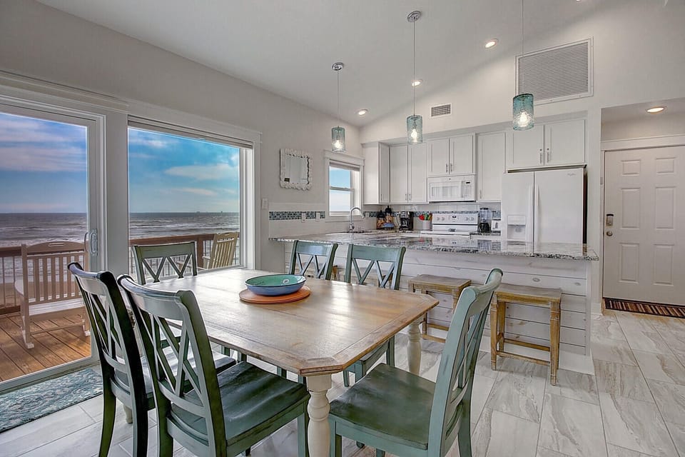 Savor meals with stunning ocean views from your beachfront dining space and fully equipped kitchen.
