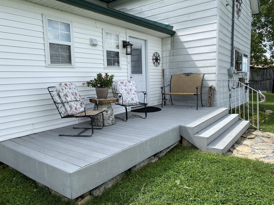 Back “coffee” porch for beautiful sunrises. Its the main entrance to the house.