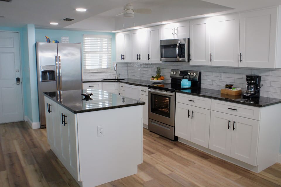 Bright, updated kitchen with soft close cabinets and drawers