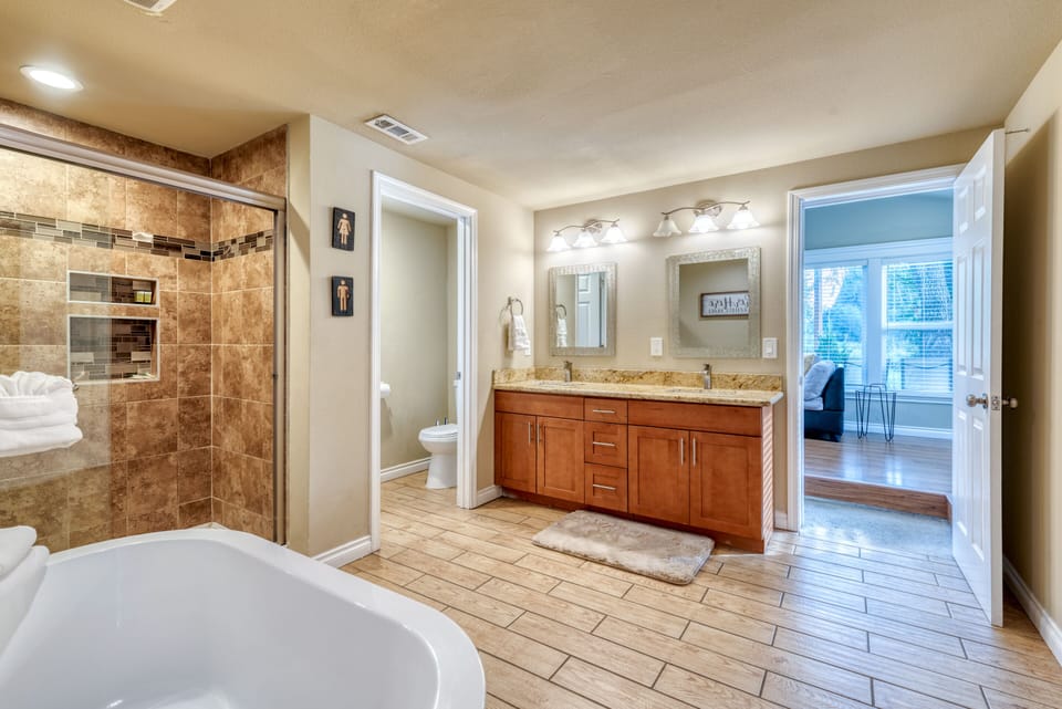 Another view of the private master bathroom. Huge walk in closet and sunroom/den