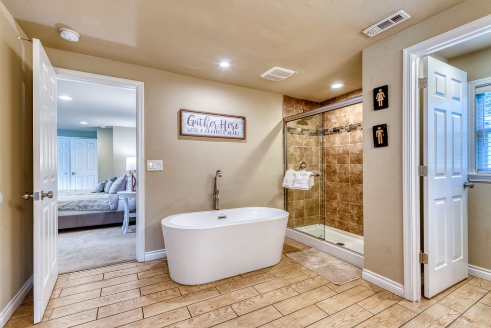 Refresh & relax in our master bathroom w/ Walk in Shower and Free Standing Tub 