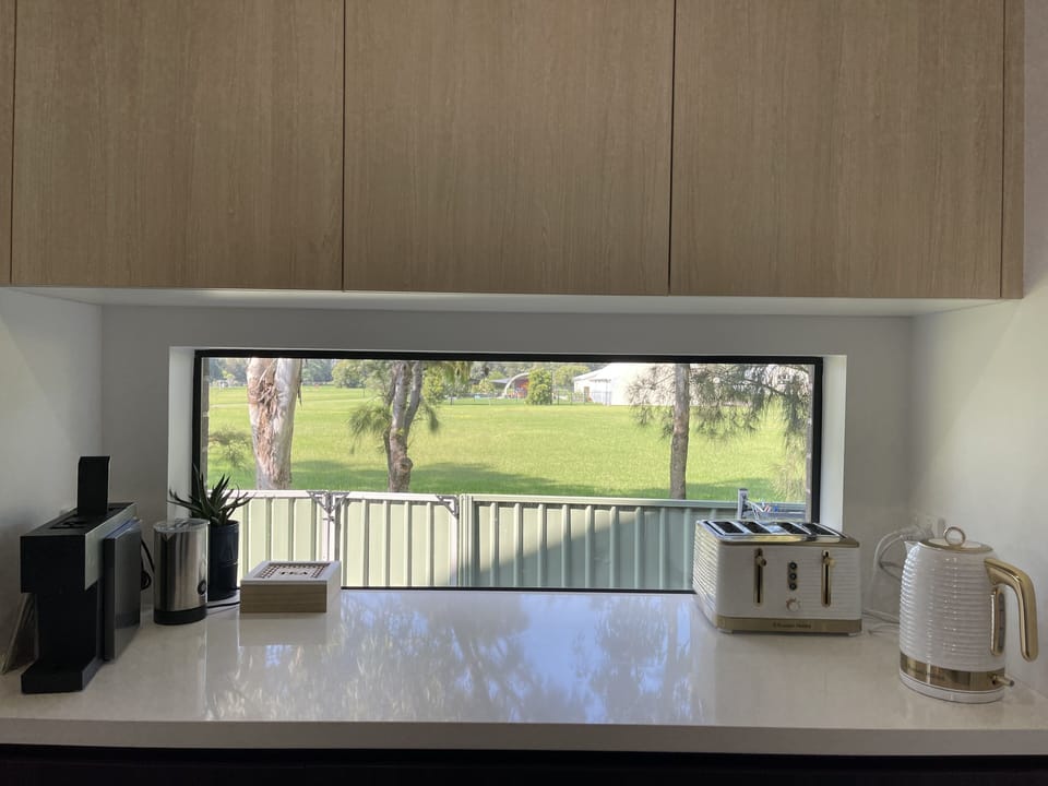 Kitchen with Coffee Pod & Cappuccino maker, kettle, and toaster