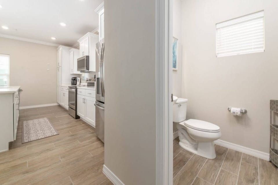 Powder room conveniently located right off the kitchen