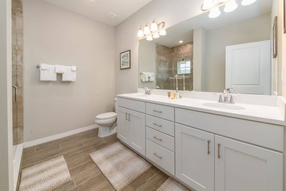 Double sinks and walk in shower in the Master Bathroom