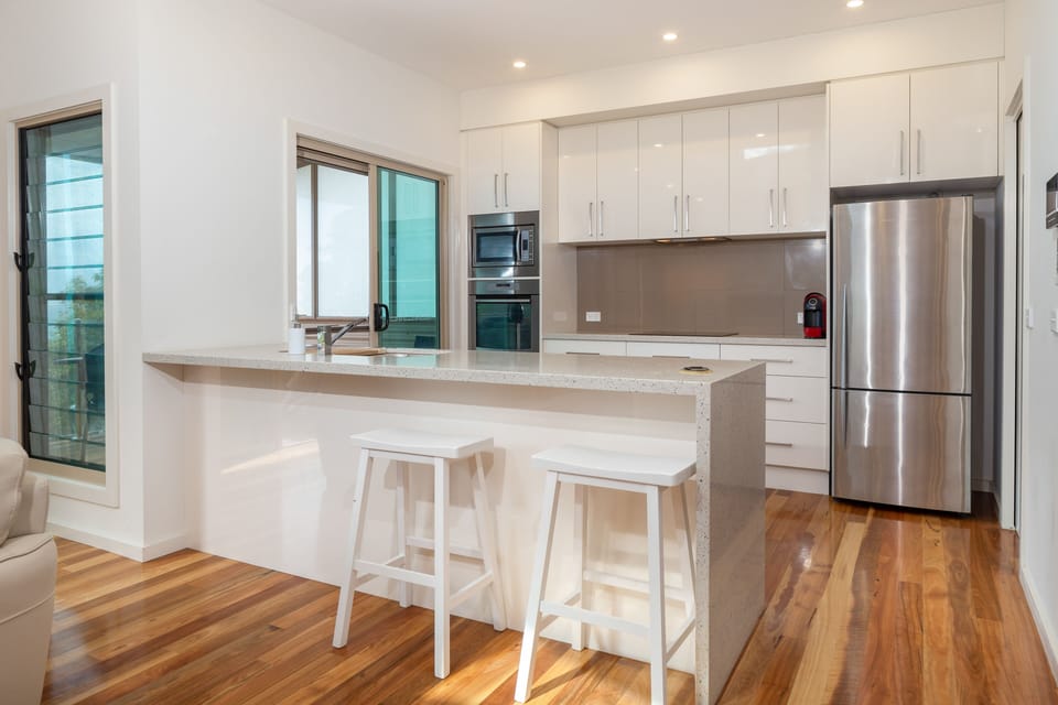 Well equipped kitchen with induction hot plates,  microwave and dishwasher