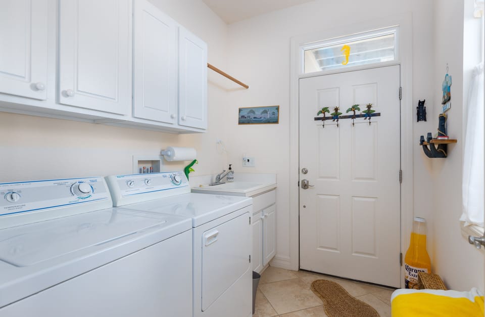 Laundry-door shown is another entry from the patio with outdoor shower!  