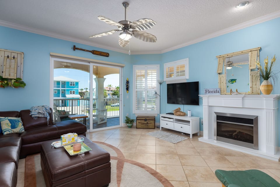 Living area with NEW leather sectional with balcony right off.