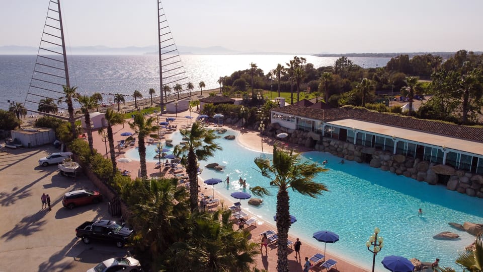 Seasonal outdoor pool, open 9:00 AM to 7:00 PM, pool umbrellas