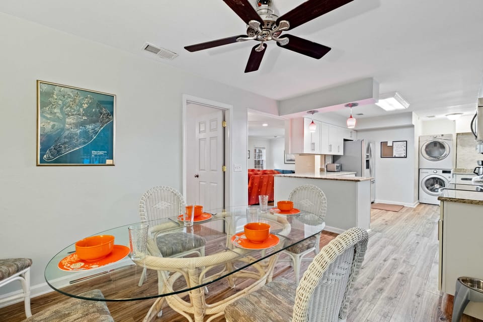 Dining area to kitchen to Den