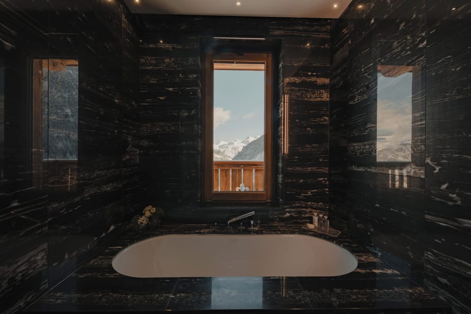 Four Bedroom Grand Chalet | Bathroom | Rainfall showerhead, hair dryer, bathrobes, slippers