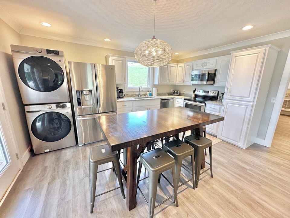 "The Rose Cottage" kitchen area. Detergent, hand soap, & dish soap provided. 