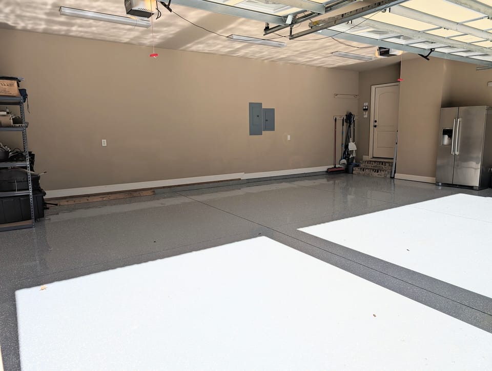three car garage with epoxy flooring 