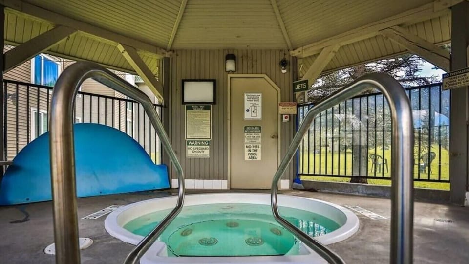 Outdoor stand alone gazebo hot tub.