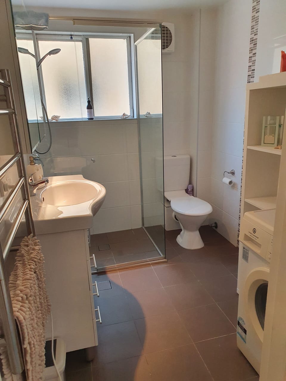 Compact modern bathroom plus washer/dryer