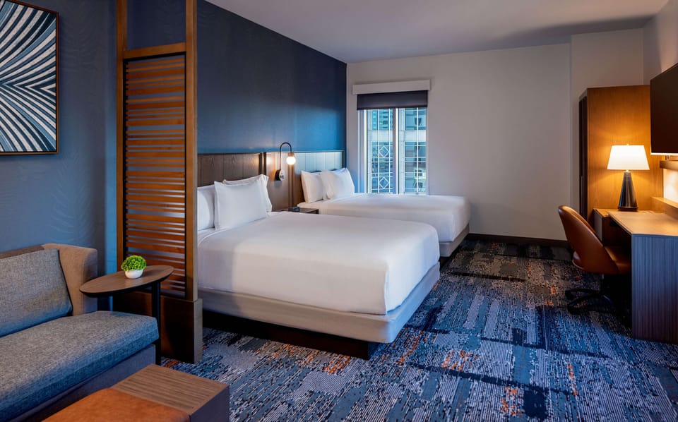 Room (2 Queen Beds with Sofa Bed) | In-room safe, desk, laptop workspace, blackout drapes
