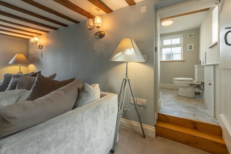Ground floor: Sitting room with steps in to shower room