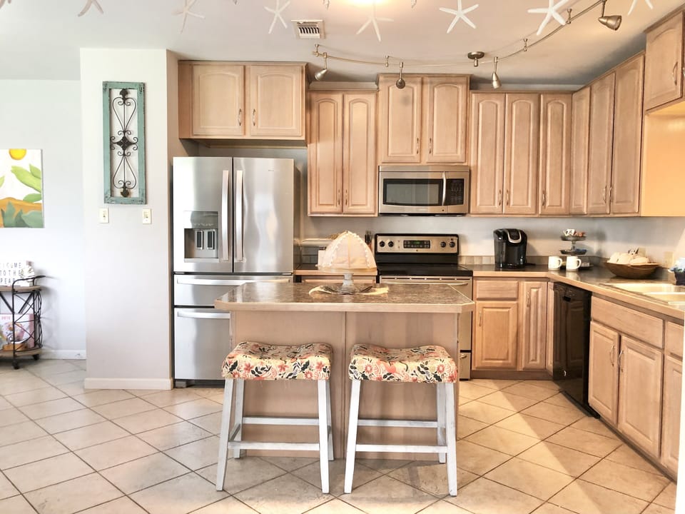 The large kitchen island is a cooks dream prep station.
