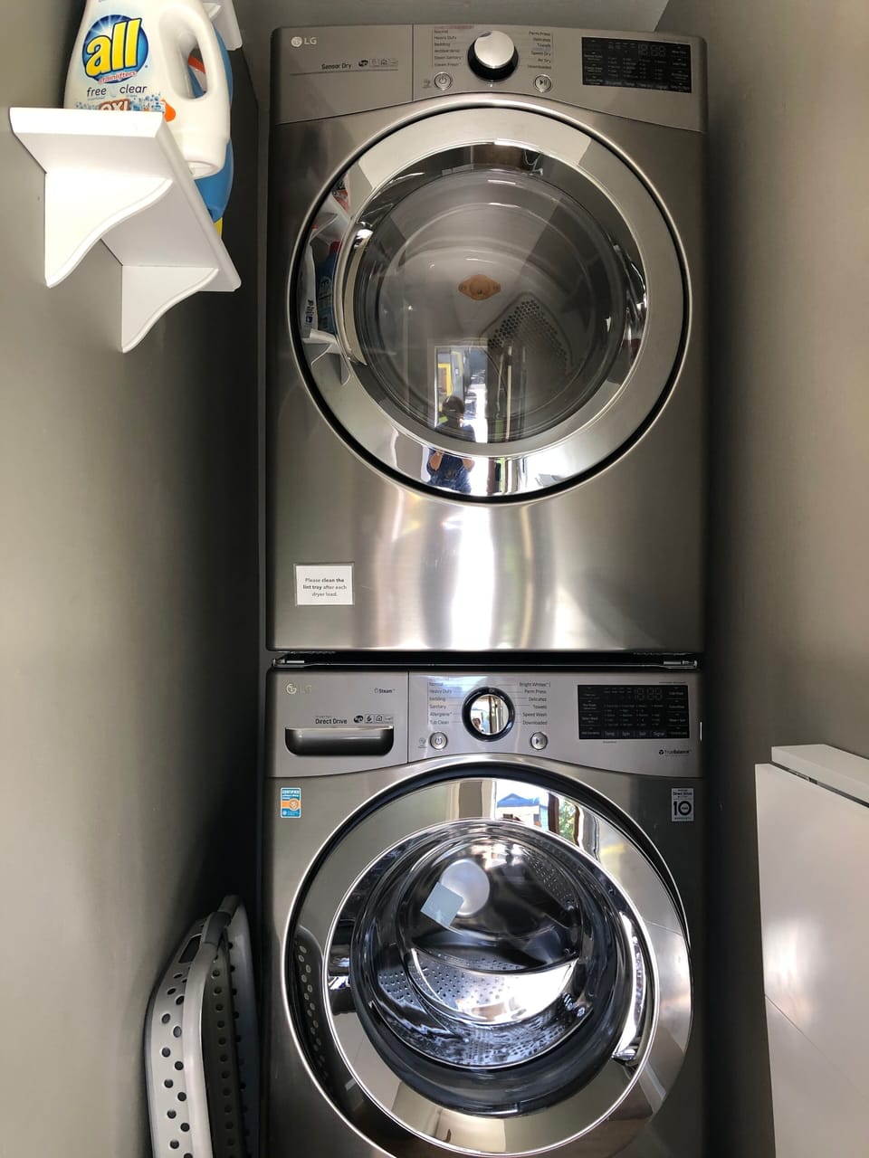 High efficiency washer and dryer in alcove next to kitchen and back door