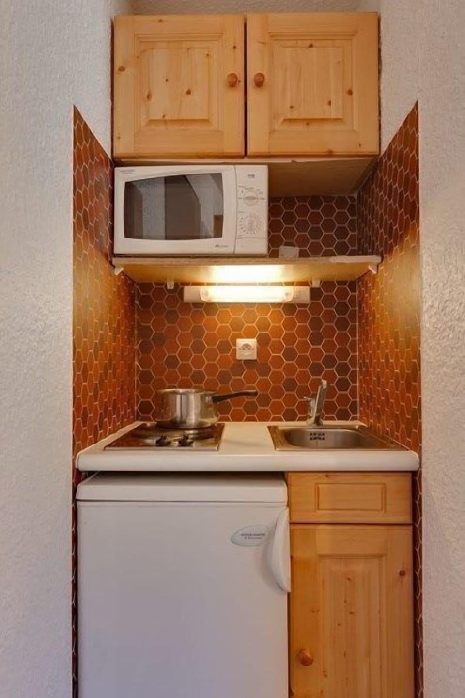 Prepare a meal in the equipped kitchenette.