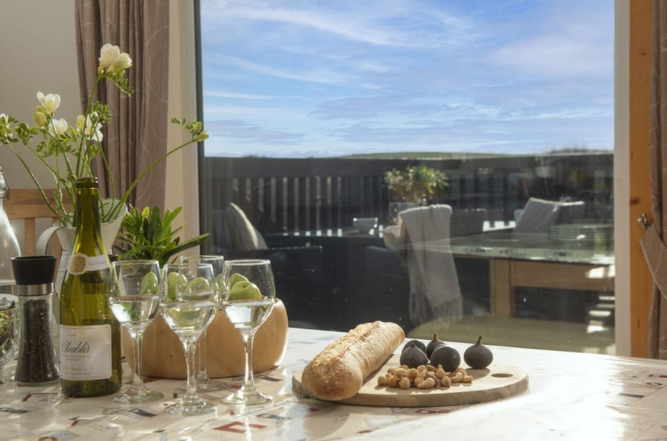 Inside dining table with view onto decking - Lodge 40, Retallack