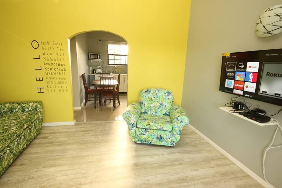 Living room with Smart TV on. Log yourself onto Netflix etc.