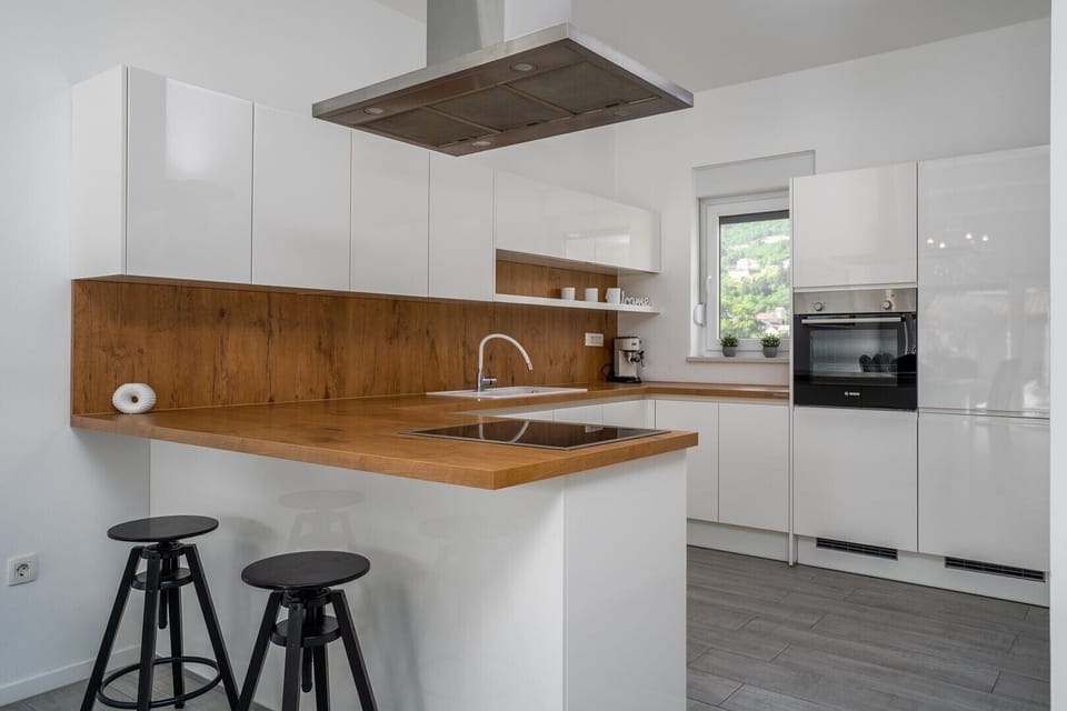 A dining area for 8 people, fully equipped kitchen