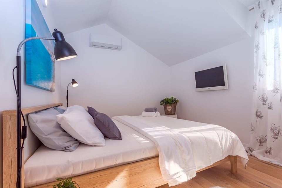 Bedroom No1 with king-size bed 180cm x 200cm, AC and a TV