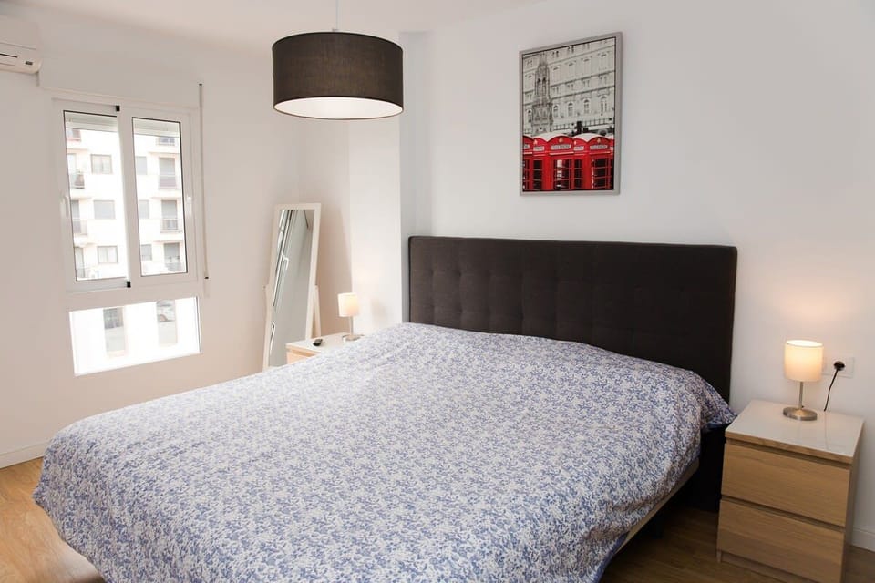 Bedroom 1, featuring a Queen-size bed. 