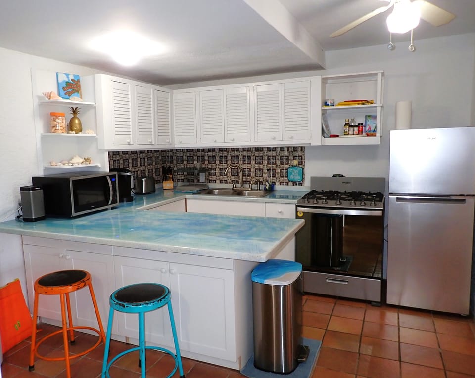 kitchen includes refrigerator, stove and oven, microwave, toaster, & Keurig