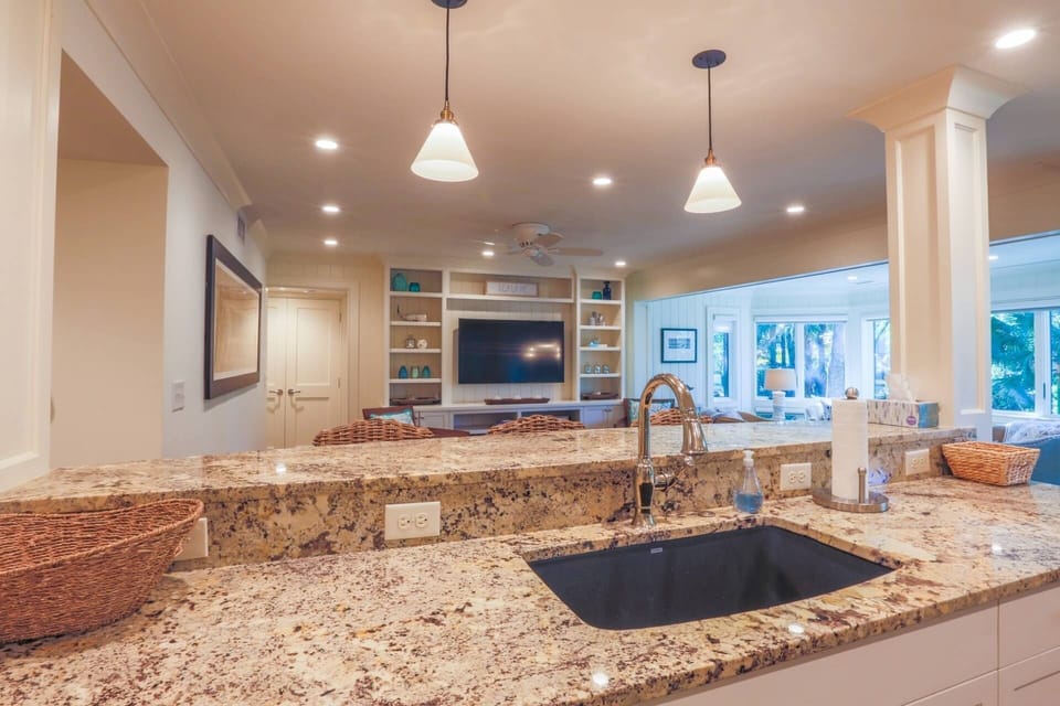 The open floor plan layout makes it easy to interact with friends & family in the kitchen, living & dining room areas.