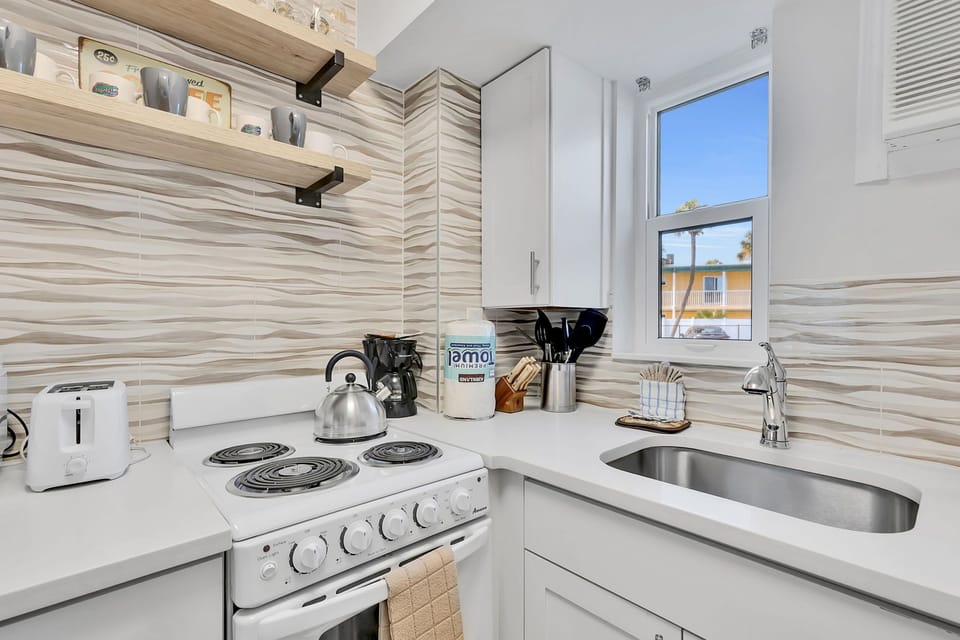 The kitchen is equipped with basics for convenience, allowing you to whip up breakfast or beach snacks without leaving the resort.